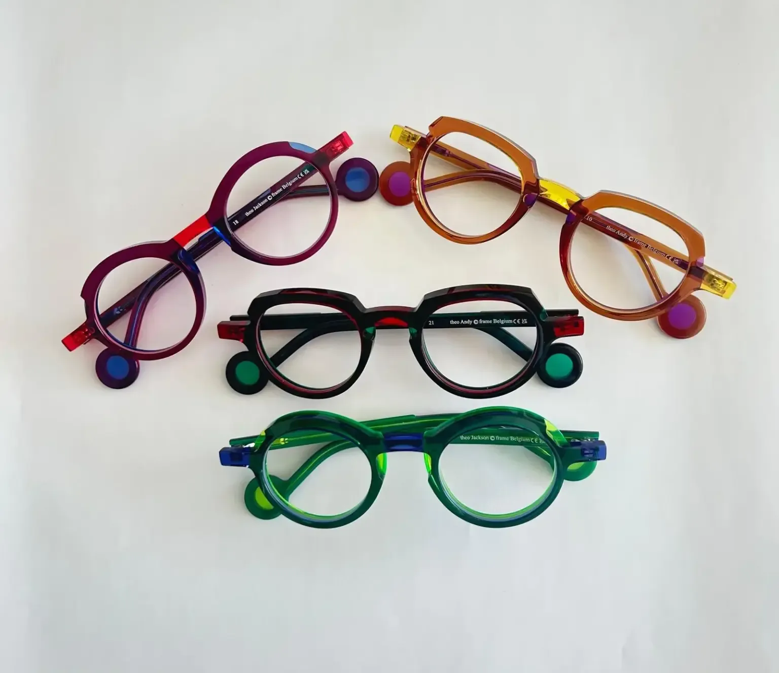 Colourful Theo eyewear frames arranged on a white background